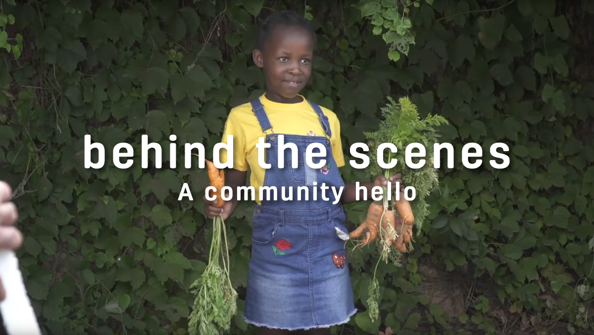 Hollard a community hello - video thumbnail of a young african girl holding carrots.